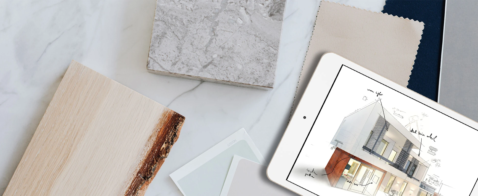 Surfplatta som visar en arkitektonisk design omgiven av trä- och marmormaterialprover på en ljus yta